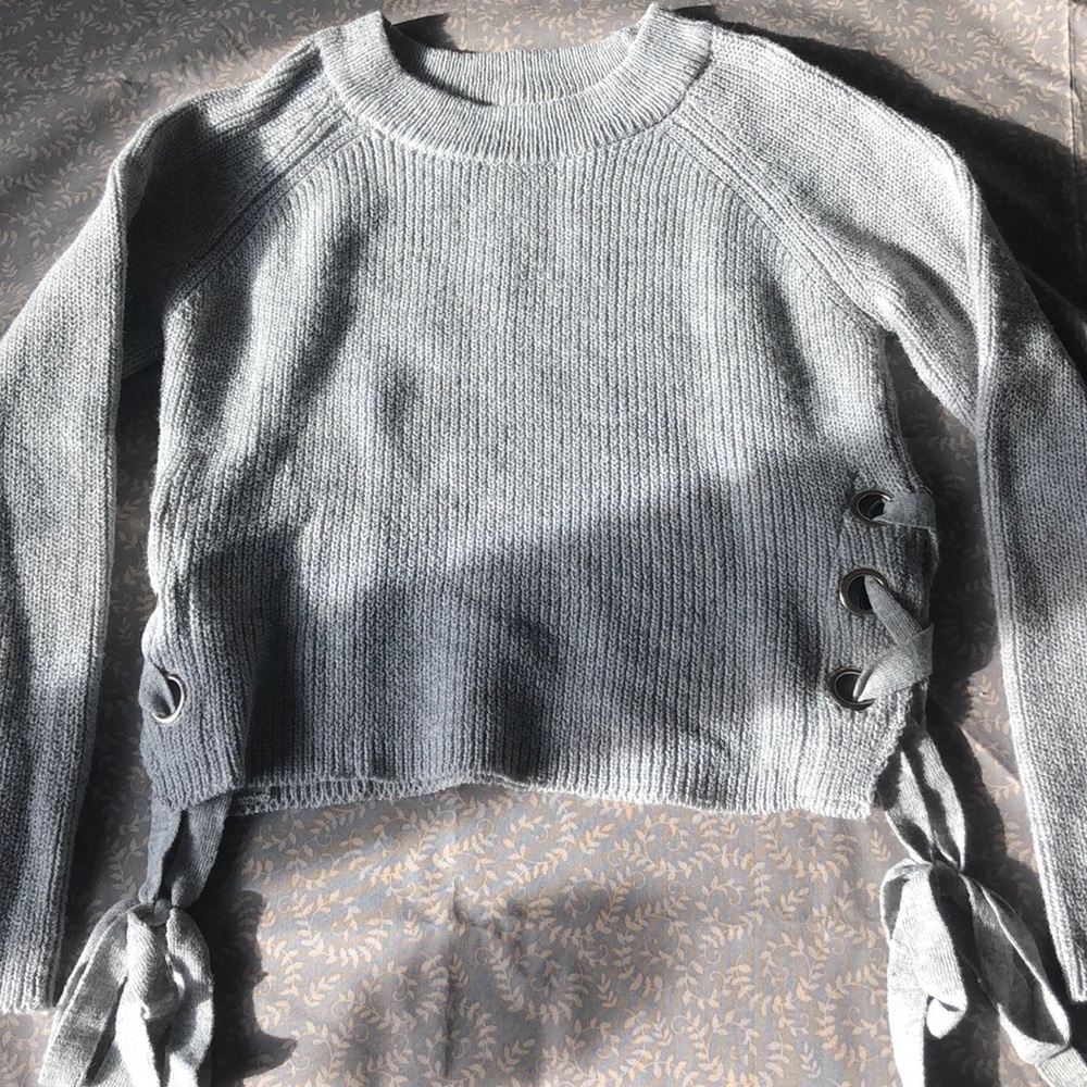 Sweater with ties on sides